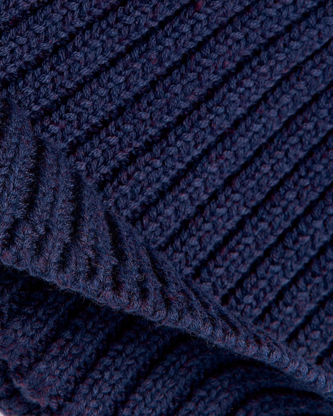 A close up image of a Saltrock Maine - Fisherman Beanie - Dark Blue.