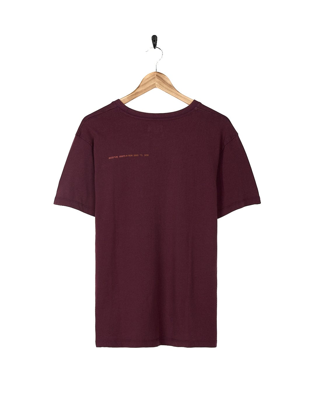 A Saltrock Adventure Awaits - Womens Short Sleeve T-Shirt - Dark Purple hanging on a wooden hanger.