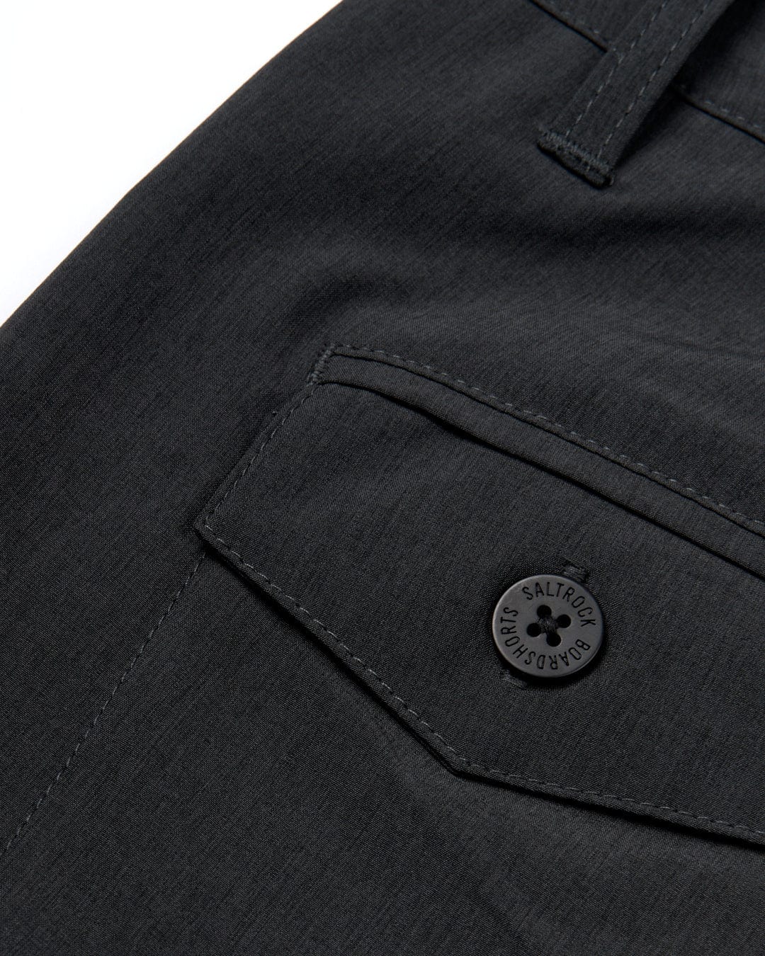 A close up of the fastening on a Saltrock Amphibian 2 - Mens Hybrid Boardshorts - Black.