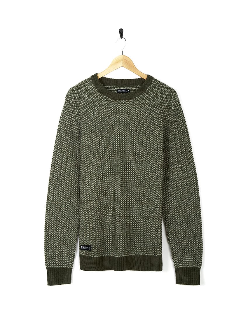 An Arlen - Mens Crew Knit - Dark Green sweater hanging on a hanger. (Brand Name: Saltrock)