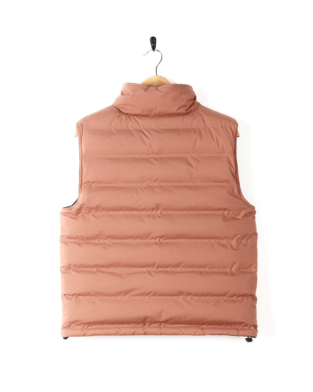 A blue/pink Saltrock Astra - Womens Reversible Padded Gilet with a detachable hood, hanging on a hanger.