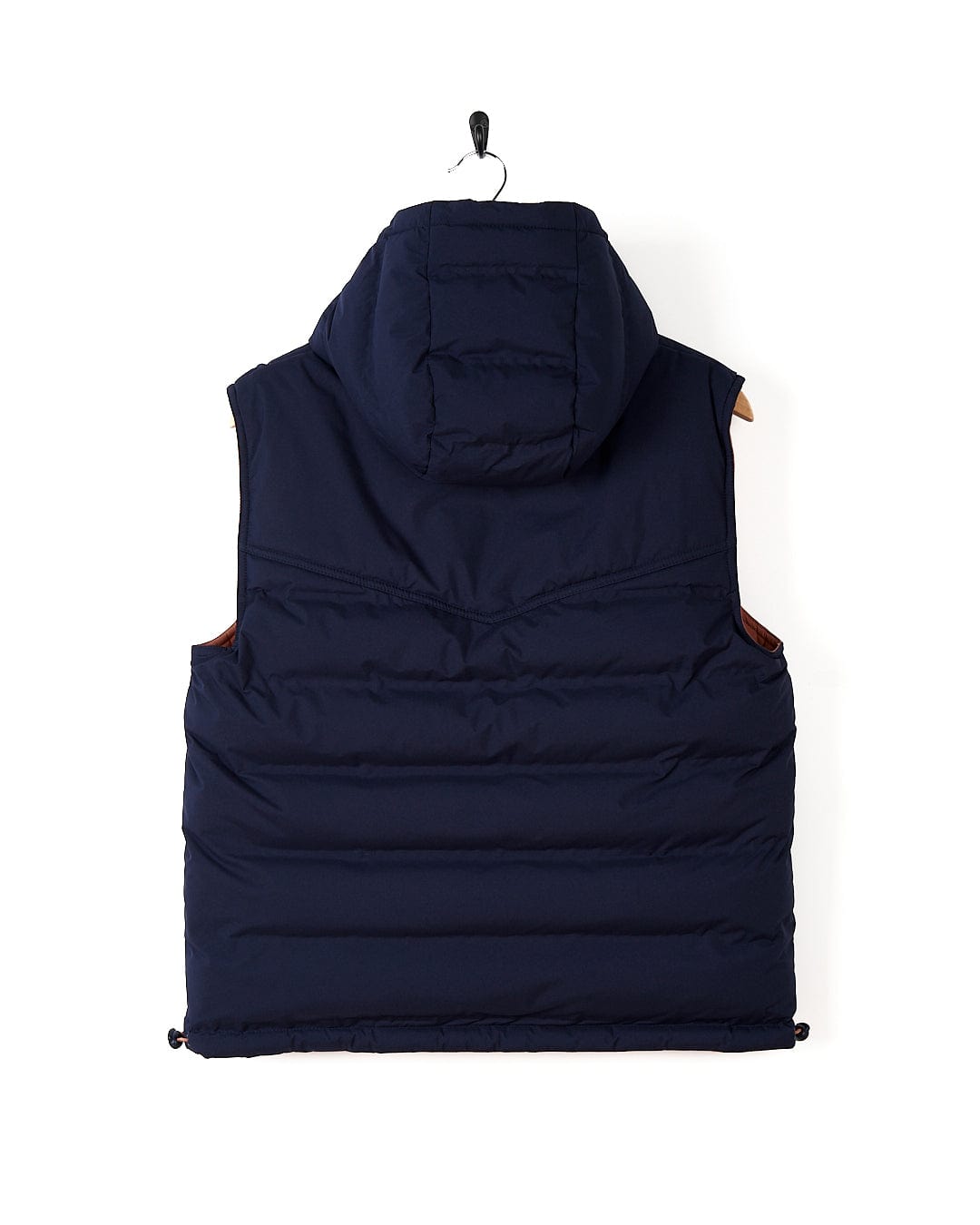 A Astra - Womens Reversible Padded Gilet - Blue/Pink Saltrock jacket with a detachable hood hanging on a white wall.