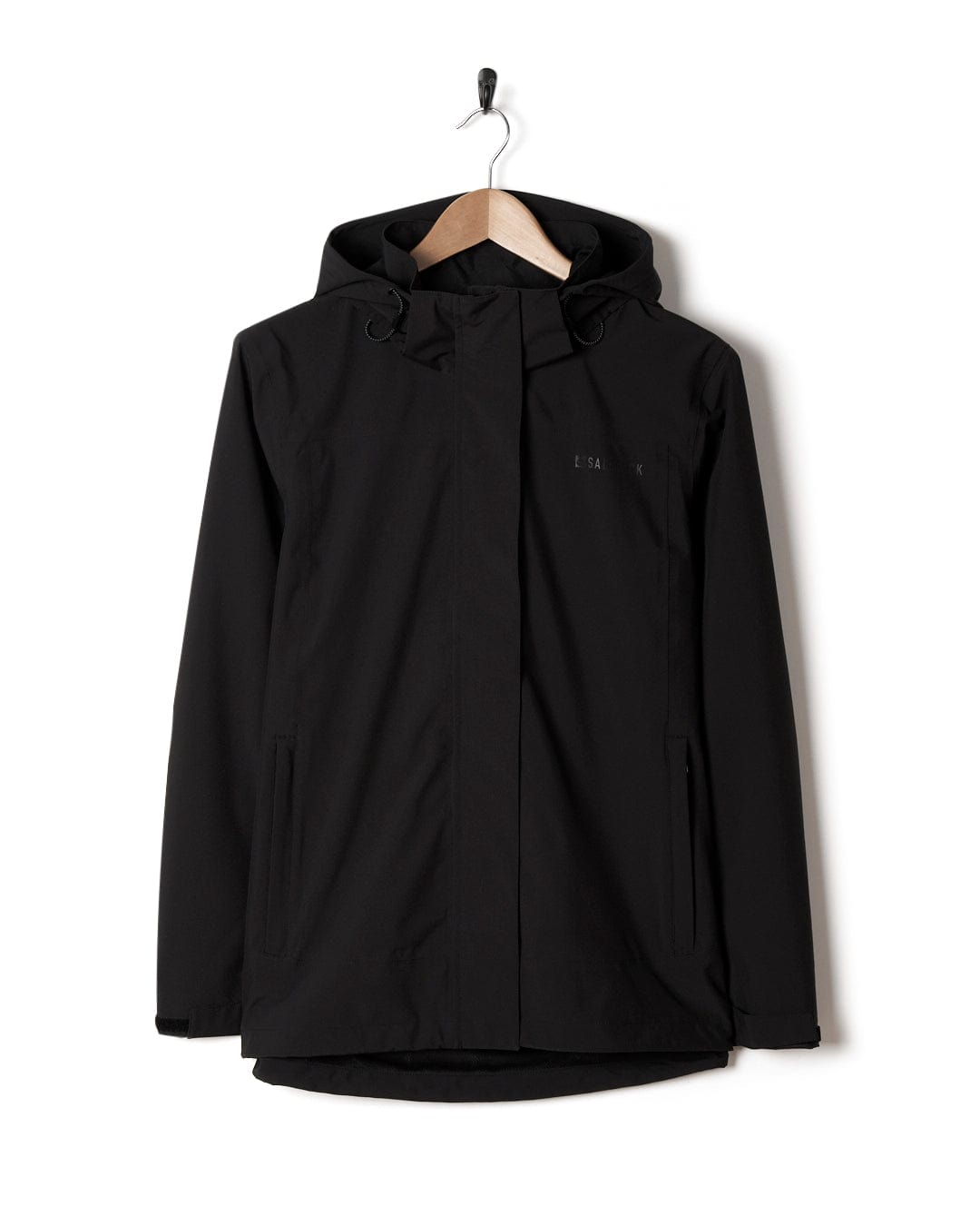 A Saltrock Aubrey - Womens Waterproof Jacket in Black, displayed on a wooden hanger against a white background.