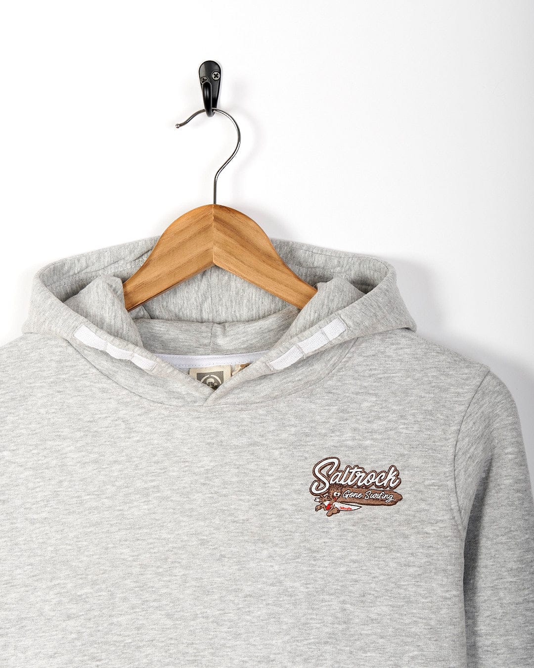 A grey Beach Signs Wales - Kids Pop Hoody - Grey with a Saltrock logo on it.