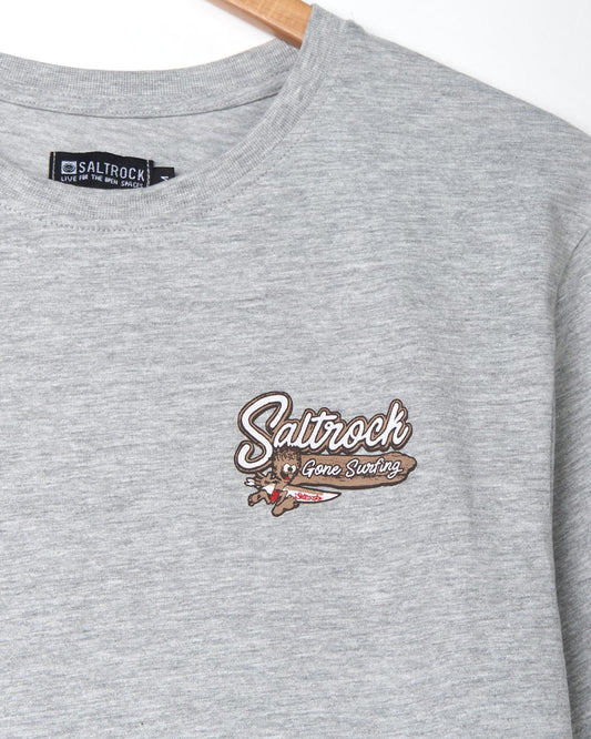 A grey cotton t-shirt with a Beach Signs Wales branding logo in brown.