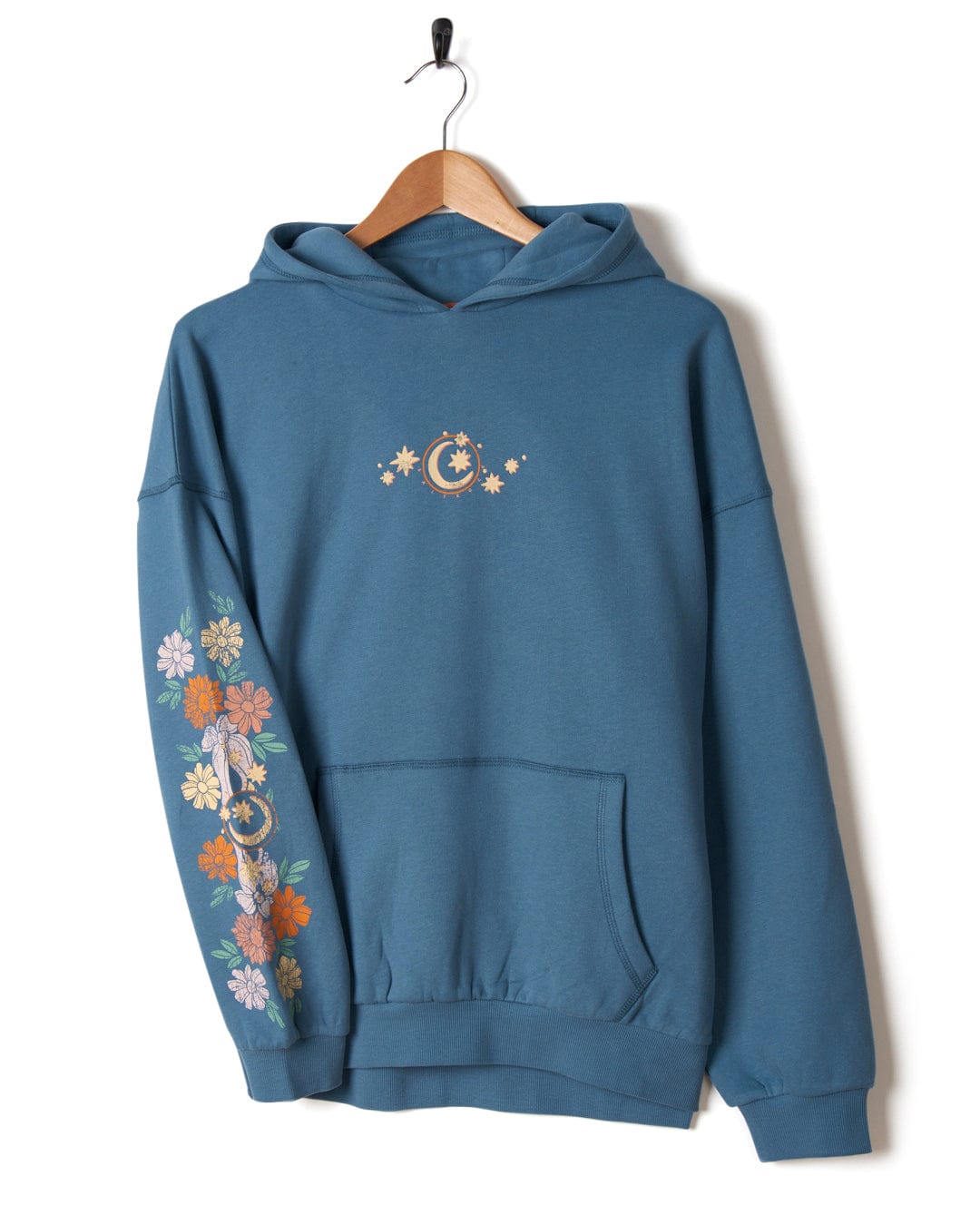 A Better Days - Womens Pop Hoodie in Blue by Saltrock with celestial and Luna designs on the sleeve hangs on a wooden hanger against a white background.