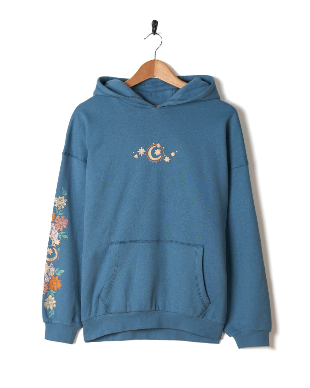 A Better Days - Womens Pop Hoodie - Blue with Luna sleeve designs and a celestial motif on the chest, hanging on a wooden hanger against a white background. (Saltrock)