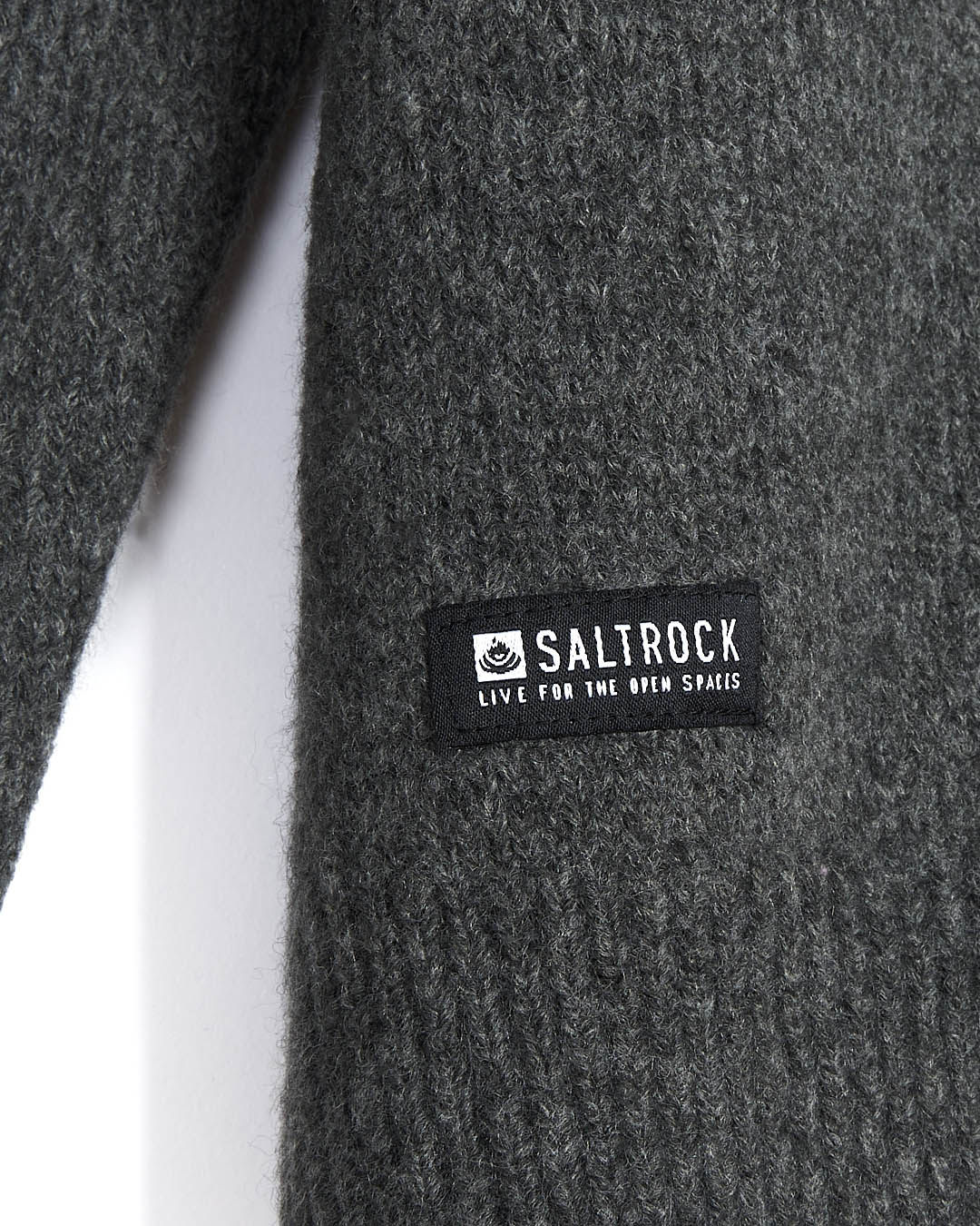 A close up of the Saltrock logo on the Bowen - Mens Knitted Crew - Dark Grey sweater.