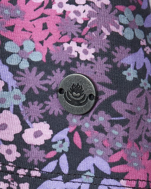 A close up of a Saltrock - Womens Long Sleeve T-Shirt - Purple with a ditsy floral print.