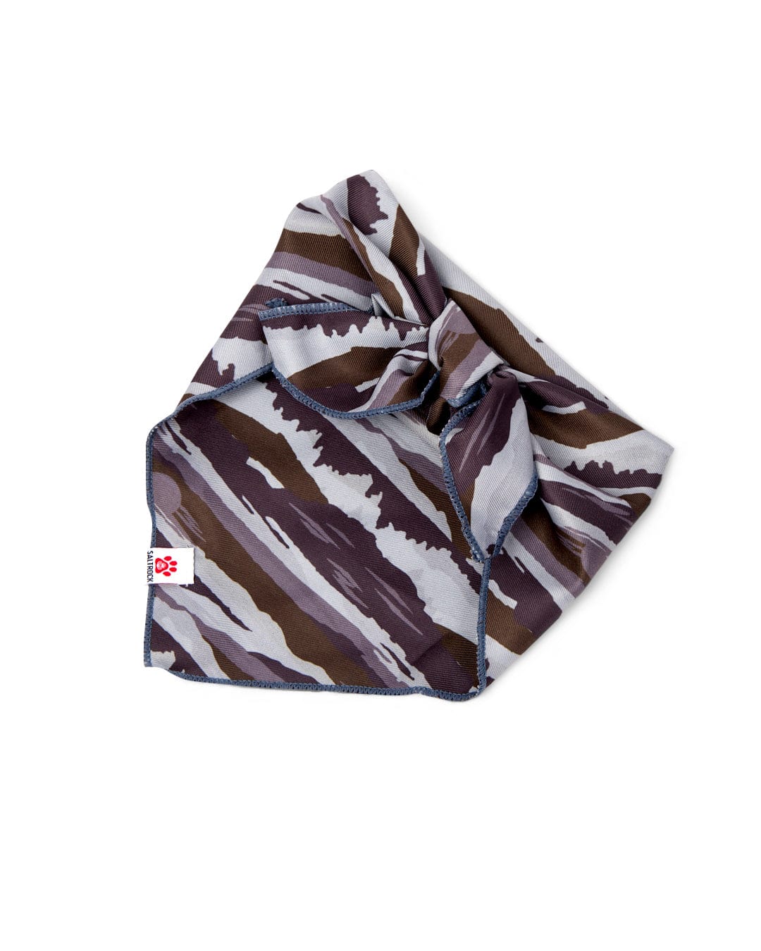 The Saltrock Camo Stripe - Pet Bandana - Green features a folded camo print with abstract green stripes and a white tag with a red paw logo—ideal as a stylish dog accessory or paired with a matching collar.