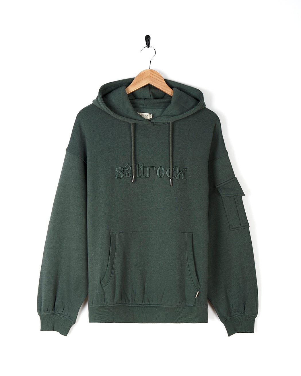 A Saltrock Celeste - Womens Pop Hoodie - Dark Green with drawstring hood hanging on a hanger.