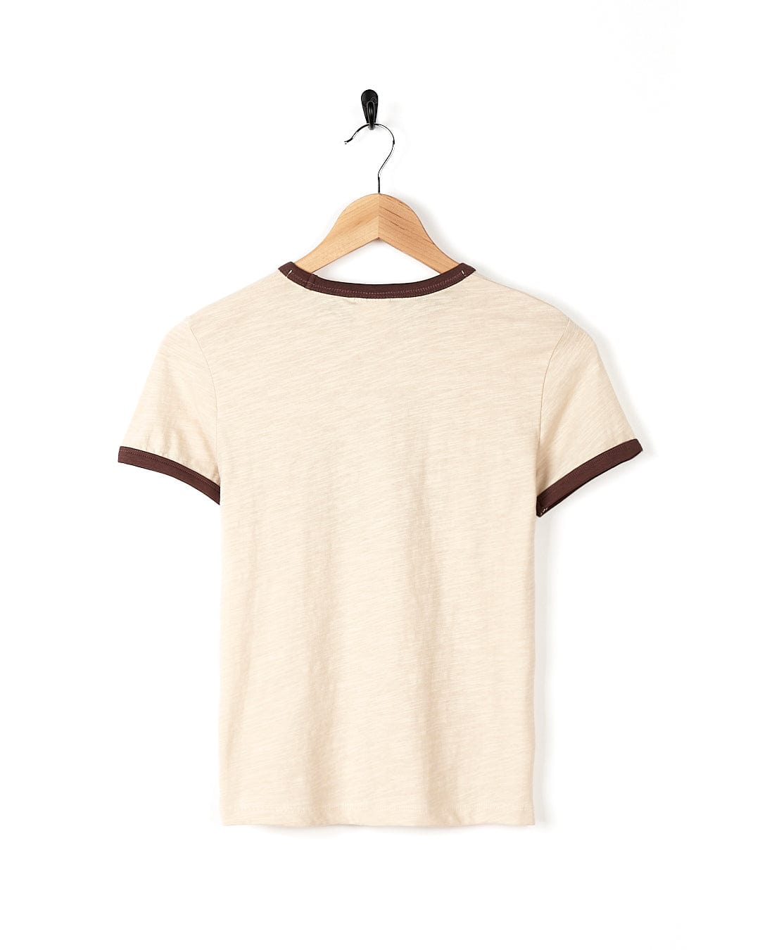 A Saltrock Change The World - Kids Short Sleeve T-Shirt - Cream hanging on a wooden hanger made of 100% cotton.