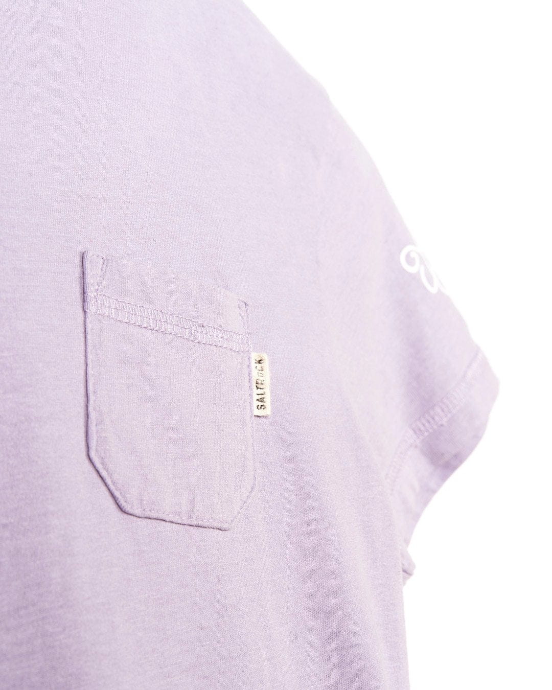 A close up of a Saltrock Chicory - Kids Snowwash Dress - Purple with a pocket.