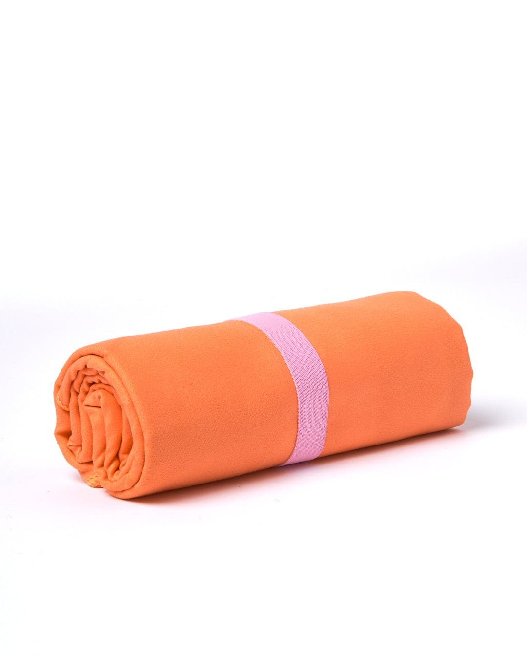 An orange, absorbent Cold Water Club microfibre towel neatly rolled up and secured with a pink elastic band on a white background.
