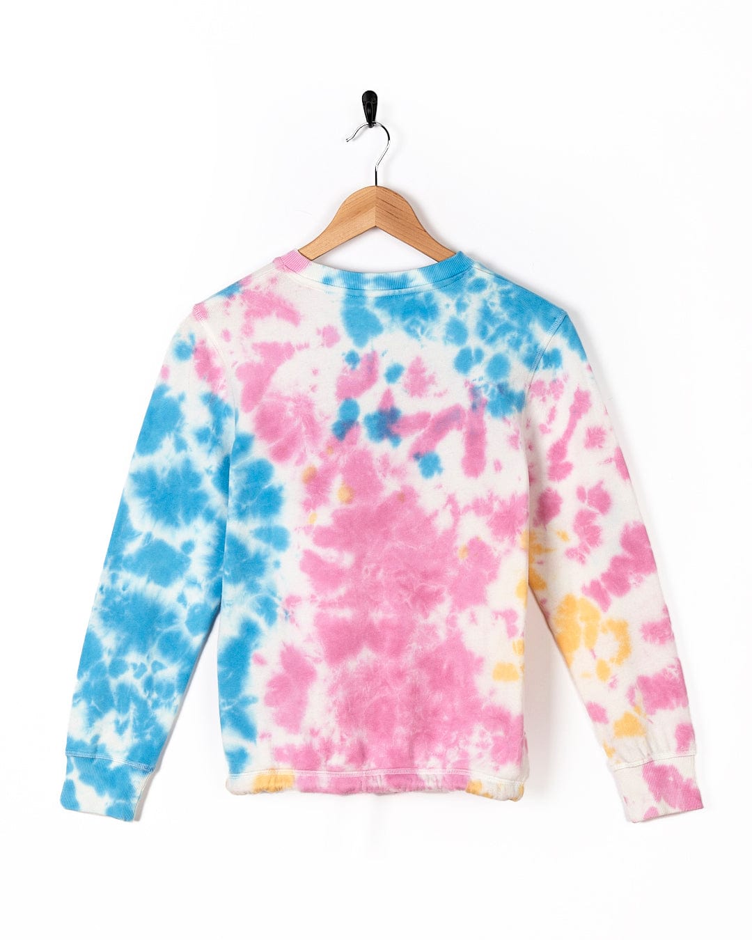 A Saltrock Coralia - Kids Tie Dye Crew Sweat - Pink shirt on a swinger.