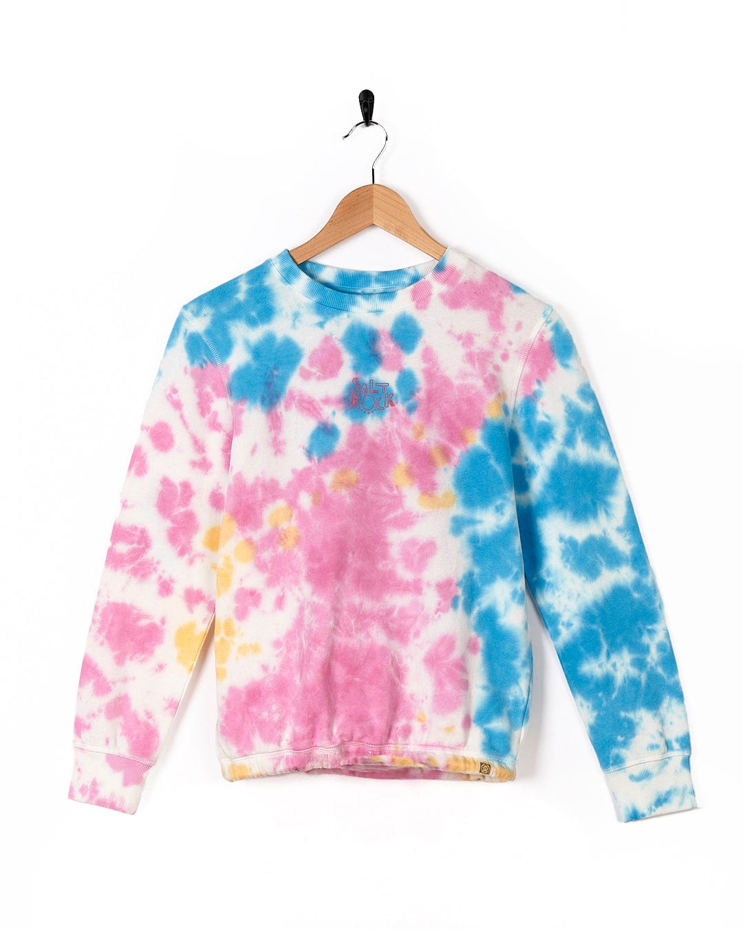 A Saltrock - Kids Tie Dye Crew Sweat - Pink shirt on a swinger.