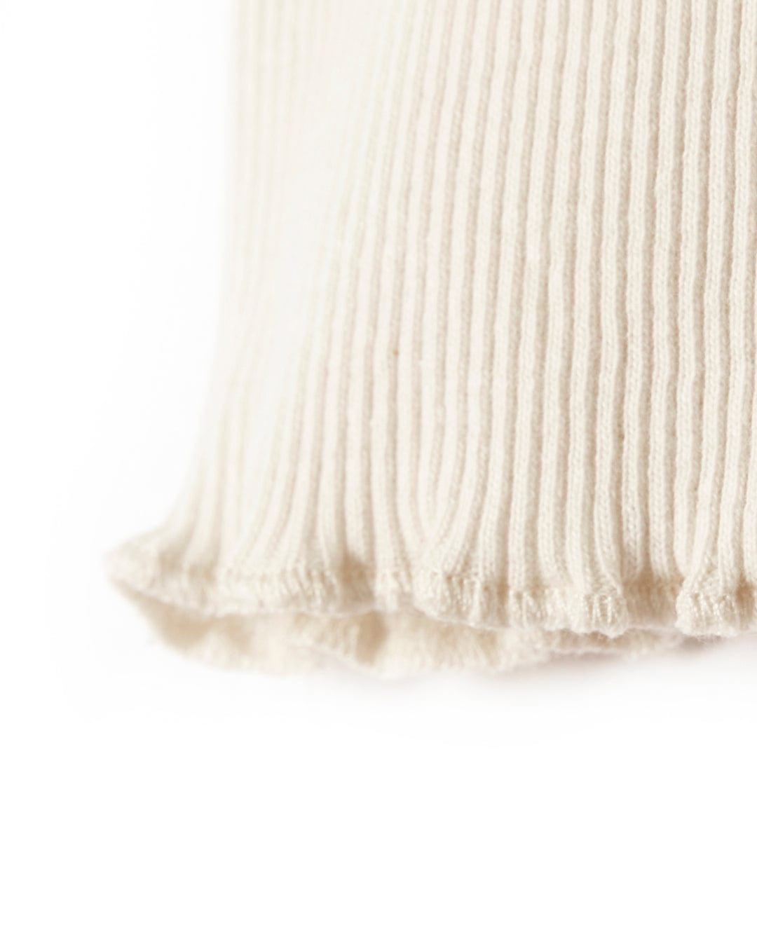 A close up of a Saltrock Cosmic Soul - Ribbed Long Sleeve T-Shirt - Cream pillow.