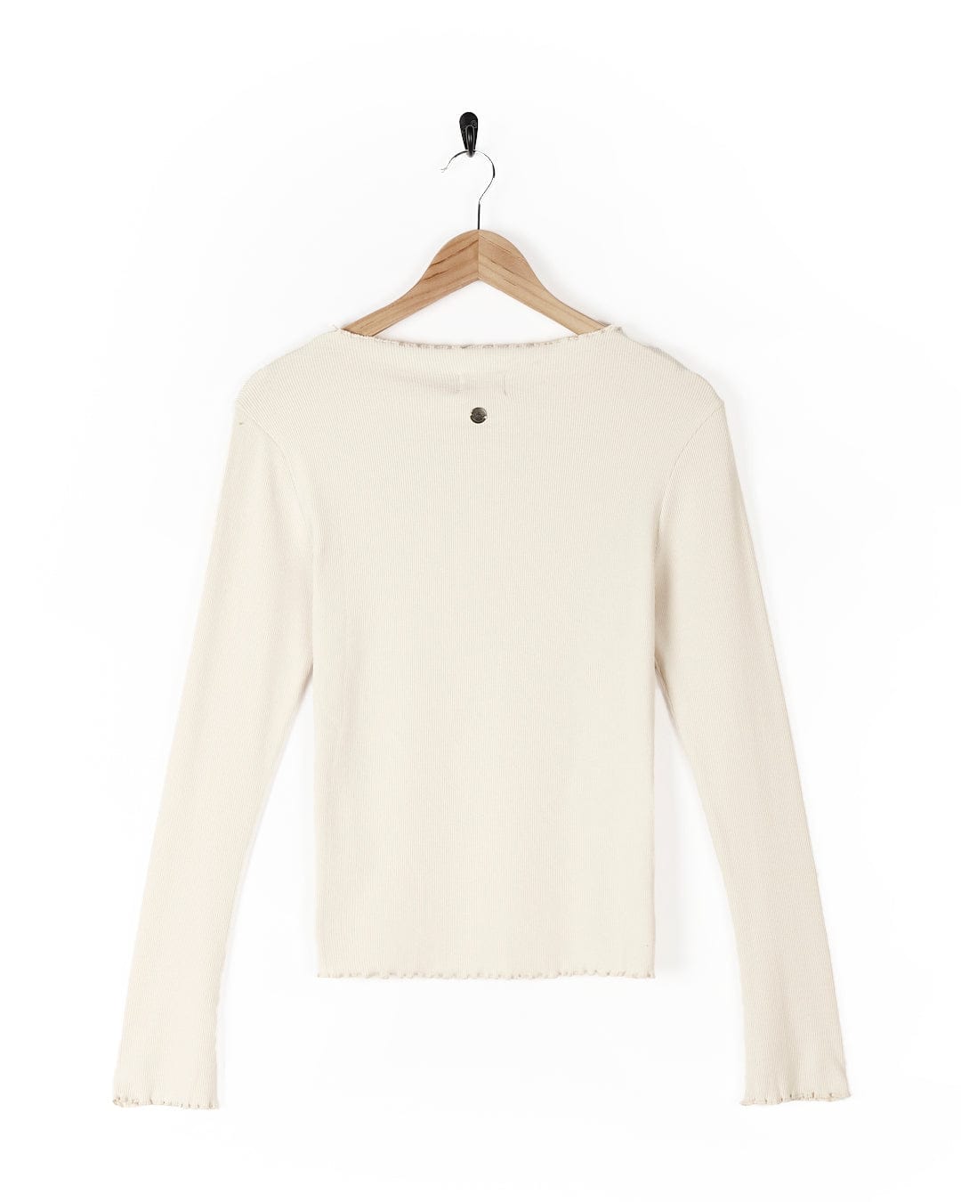 A Saltrock Cosmic Soul - Ribbed Long Sleeve T-Shirt - Cream hanging on a wooden hanger.