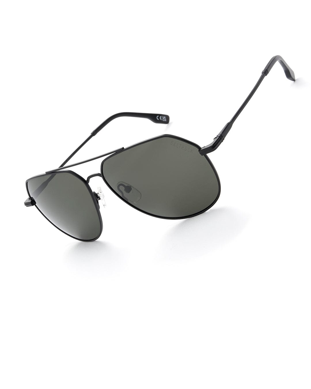 A pair of Saltrock Cruiser - Aviator Polarised Sunglasses in black with a metal frame on a white background.