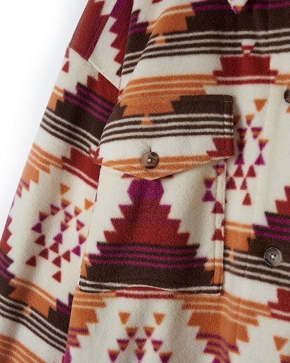 A close up of a Saltrock Dallyn - Womens Aztec Fleece Shacket - Orange with a colorful Aztec print.