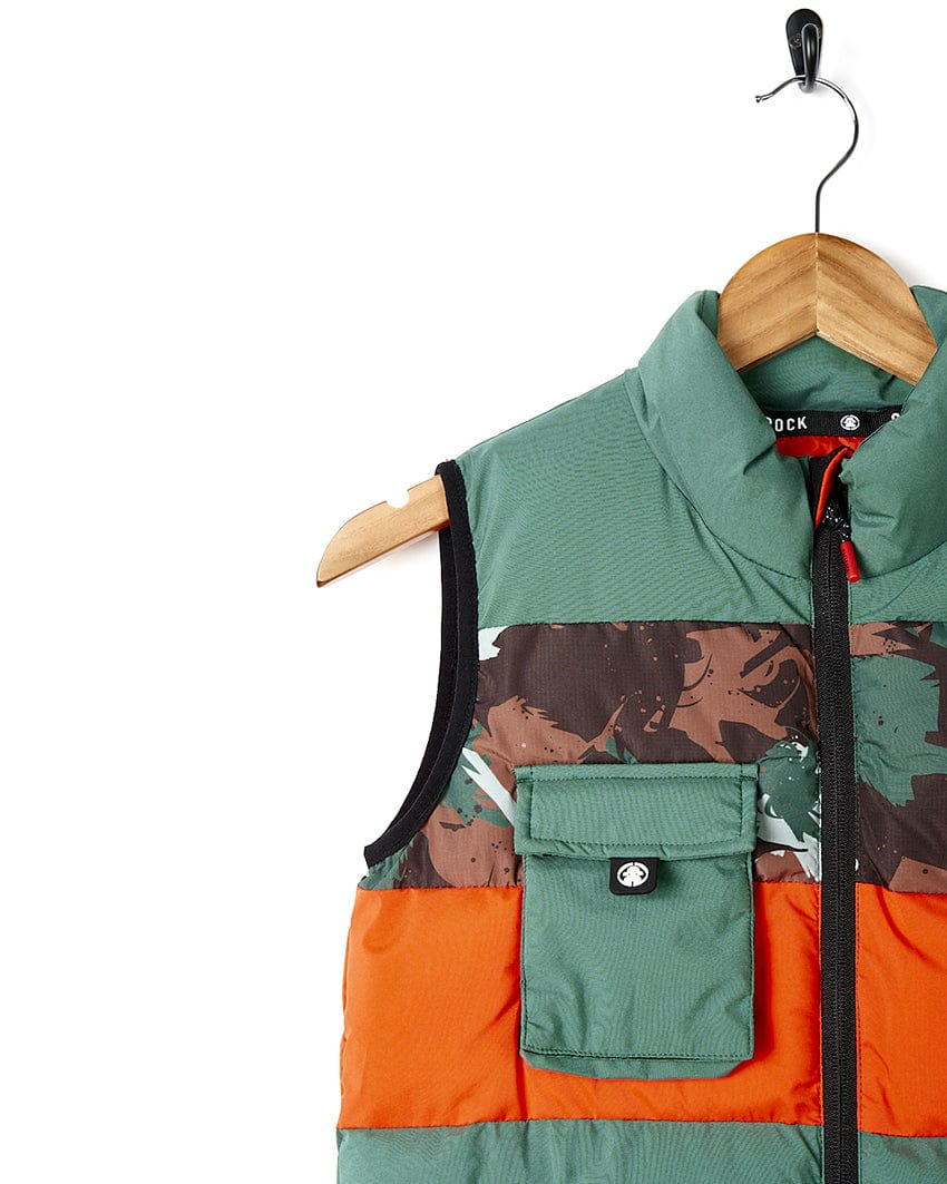 A Saltrock Destroya - Kids Padded Gilet - Green/Camo with a pocket on it.