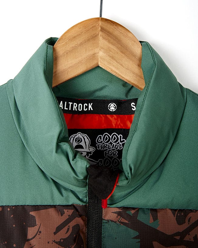 A Saltrock Destroya - Kids Padded Gilet - Green/Camo hanging on a hanger.