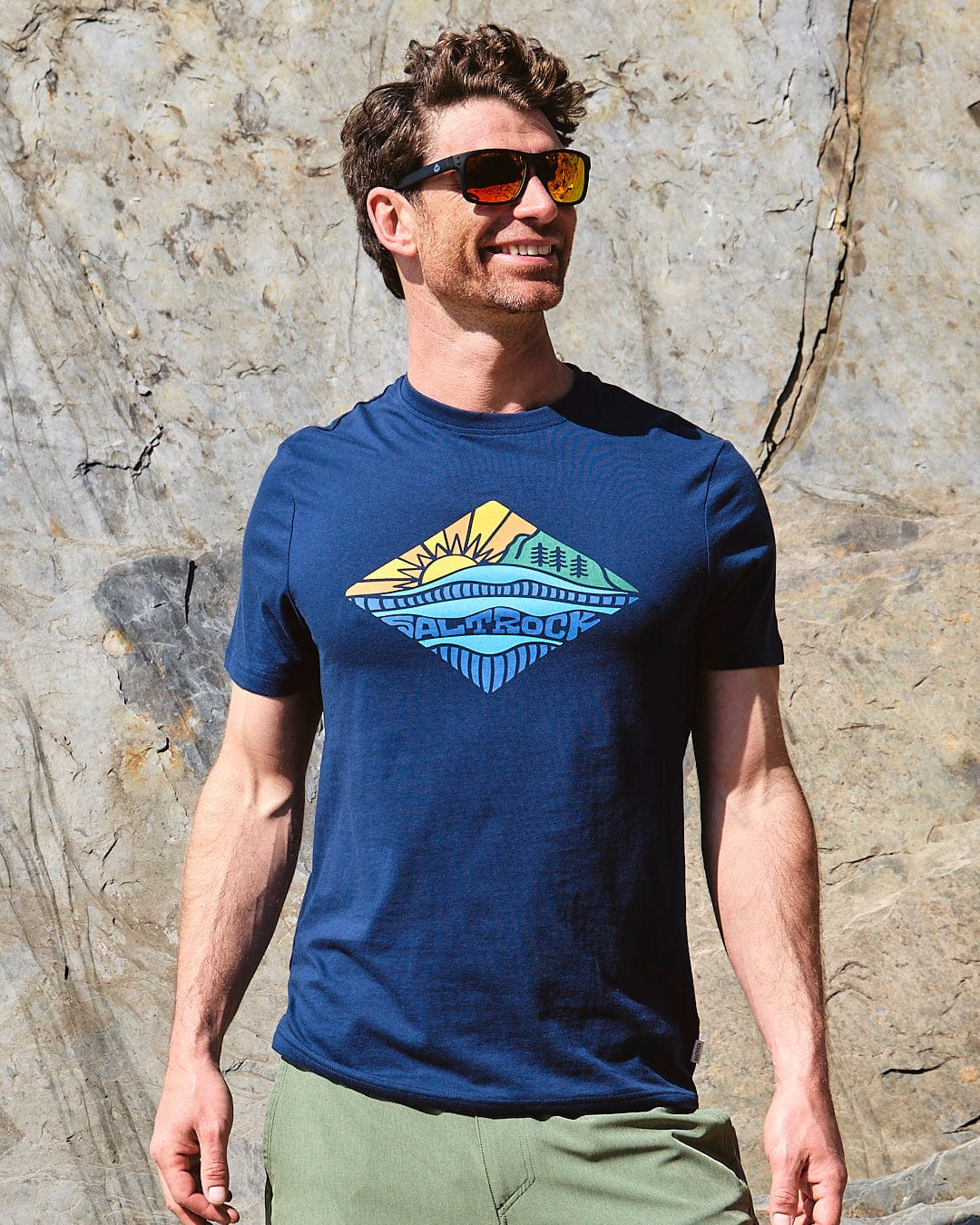 A man wearing sunglasses and a Saltrock Diamond Scene - Mens Short Sleeve T-Shirt - Blue.