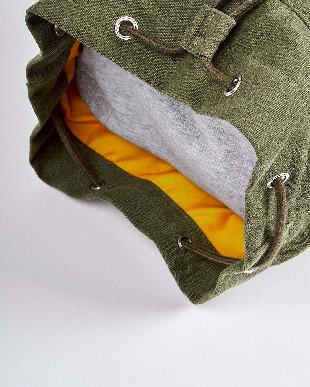 A Dark Green Dockyard - Duffle Bag by Saltrock with a yellow lining.