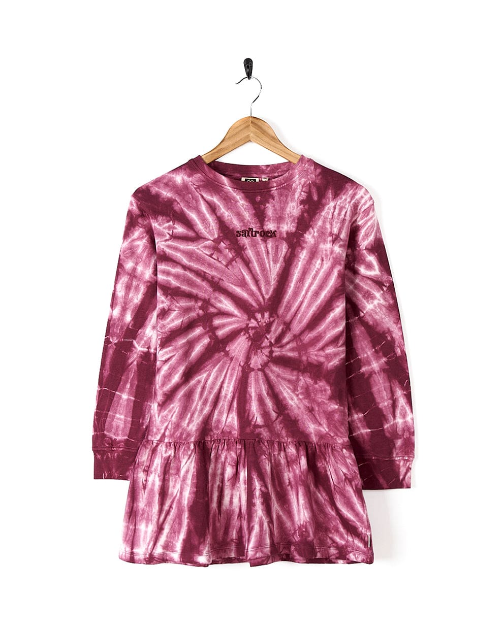 An Effie - Kids Tie Dye Sweatdress - Pink by Saltrock hanging on a hanger.
