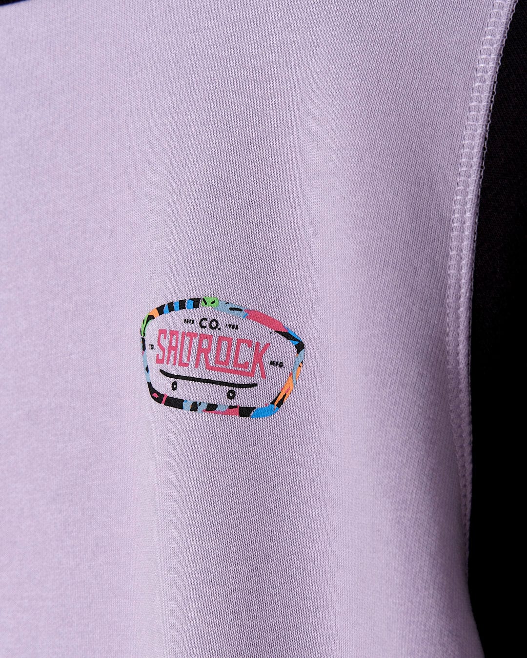 A Saltrock Elissa - Kids Crew Sweat - Light Purple with a colorful logo on it.