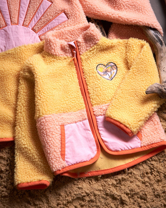 A Saltrock Emery Sunshine - Kids Sherpa Fleece - Yellow and pink jacket with colour block panels and a heart embroidered on it.