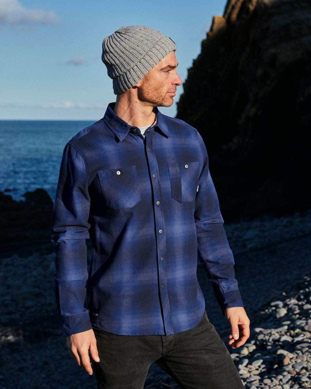 A man wearing a Saltrock Farris - Mens Check Shirt - Blue with a beanie.