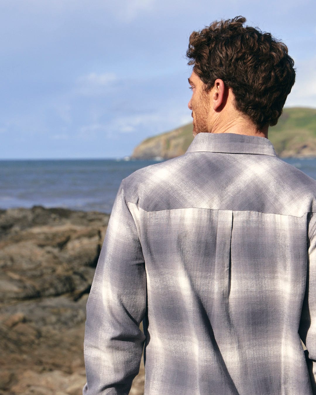 A man wearing a Saltrock Farris - Mens Long Sleeve Check Shirt - Grey with chest pockets.