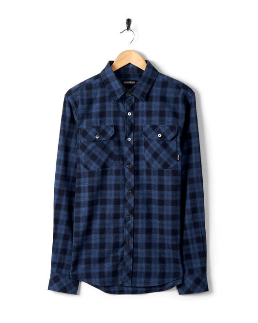 Farrow - Mens Long Sleeve Shirt in Blue plaid by Saltrock on a hanger against a white background.