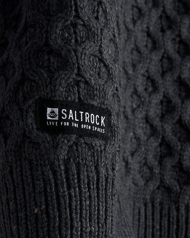 A Flint - Mens 1/4 Neck Zip Knit - Black sweater with the Saltrock logo on it.