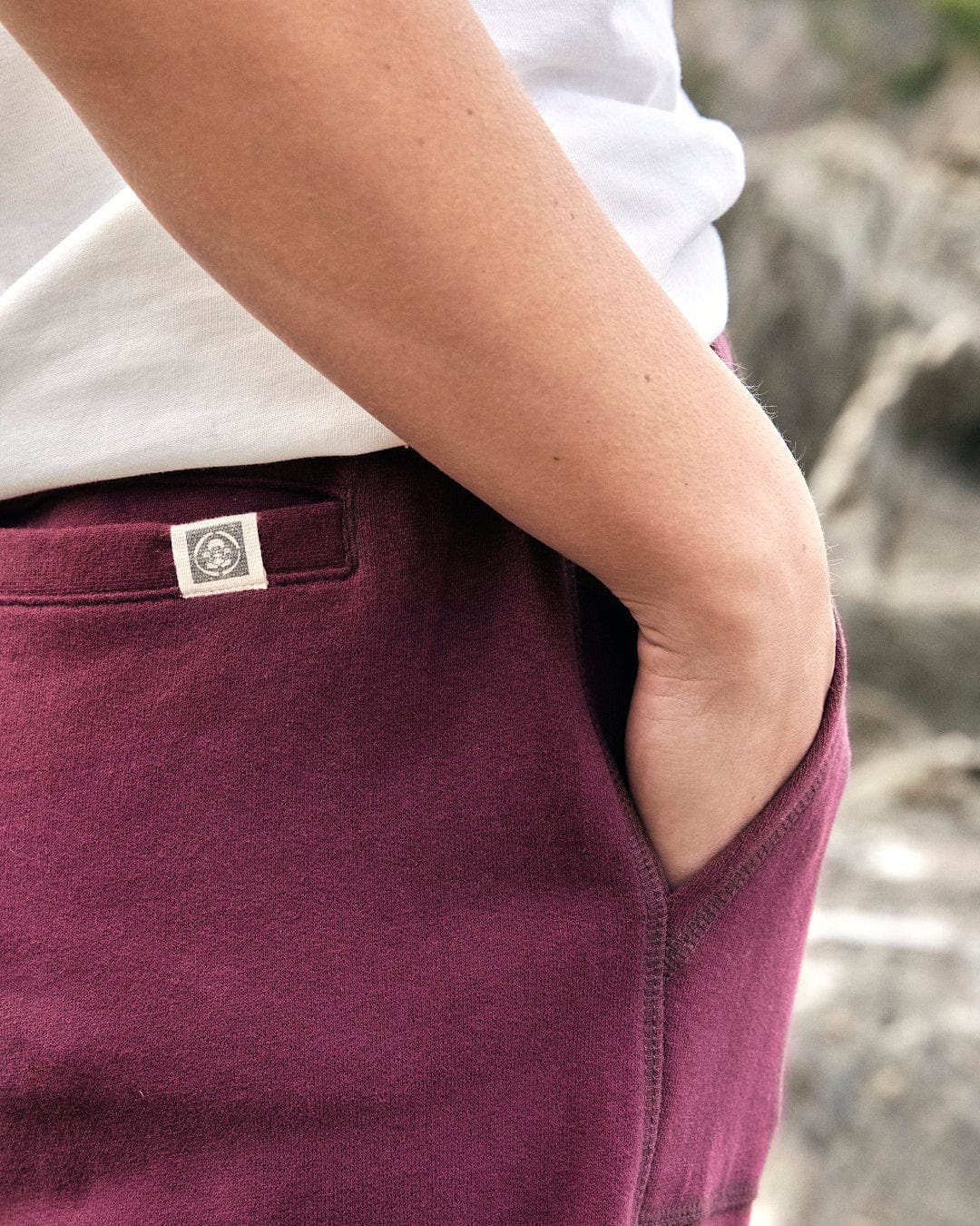 A stylish woman wearing Saltrock's Flo - Womens Jogger - Purple sweatpants.