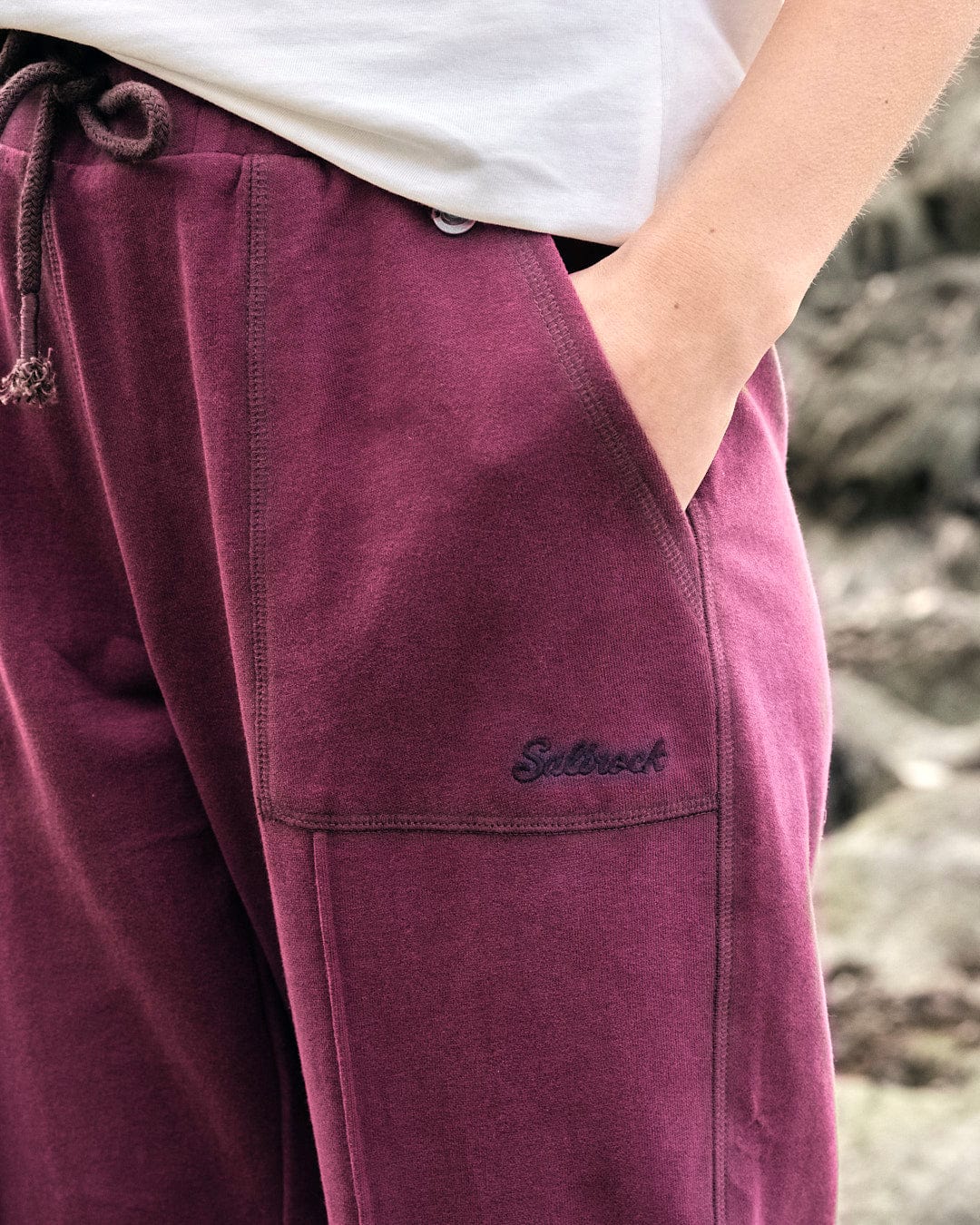 A woman wearing Saltrock Flo - Womens Jogger - Purple.