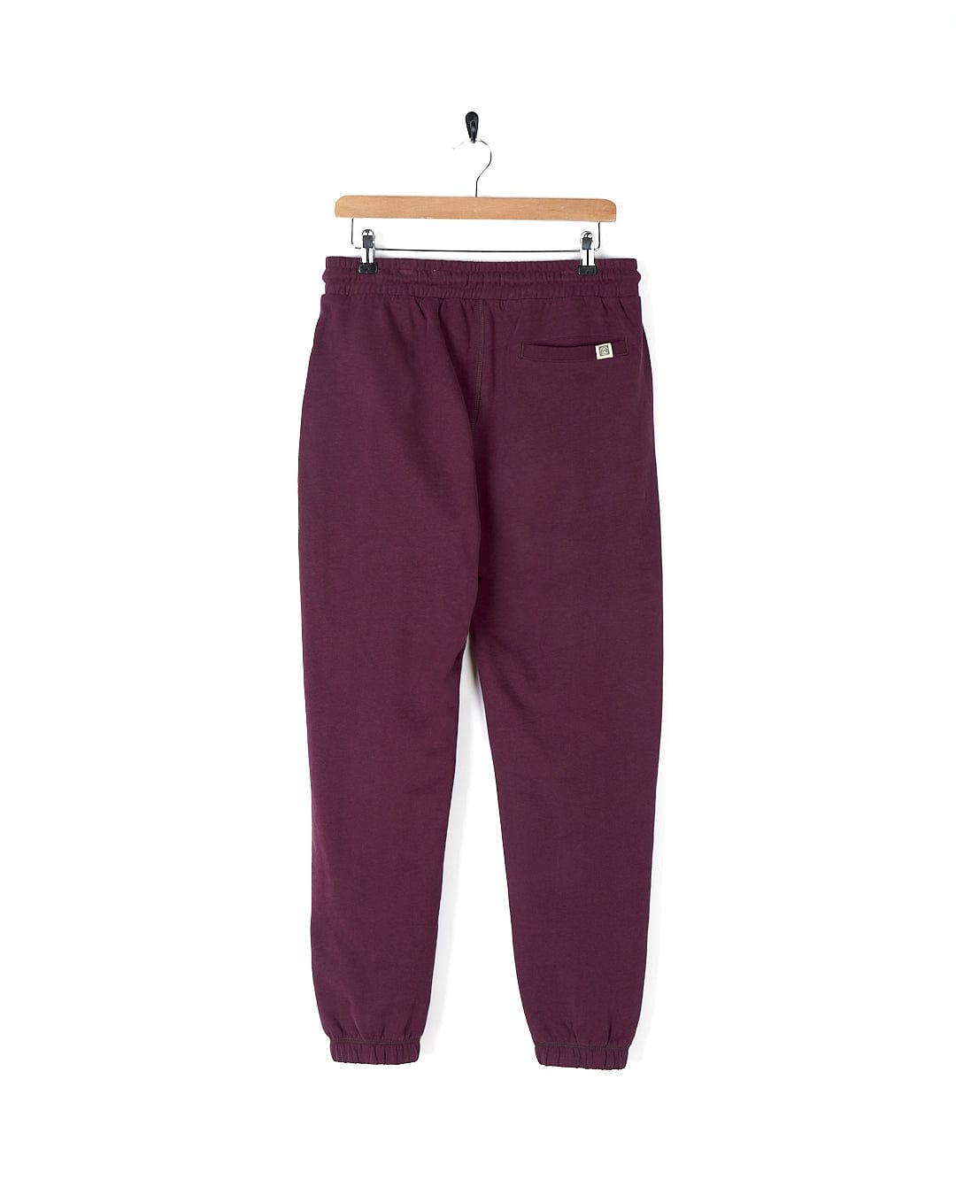 A comfy Saltrock - Womens Jogger - Purple hanging on a hanger.
