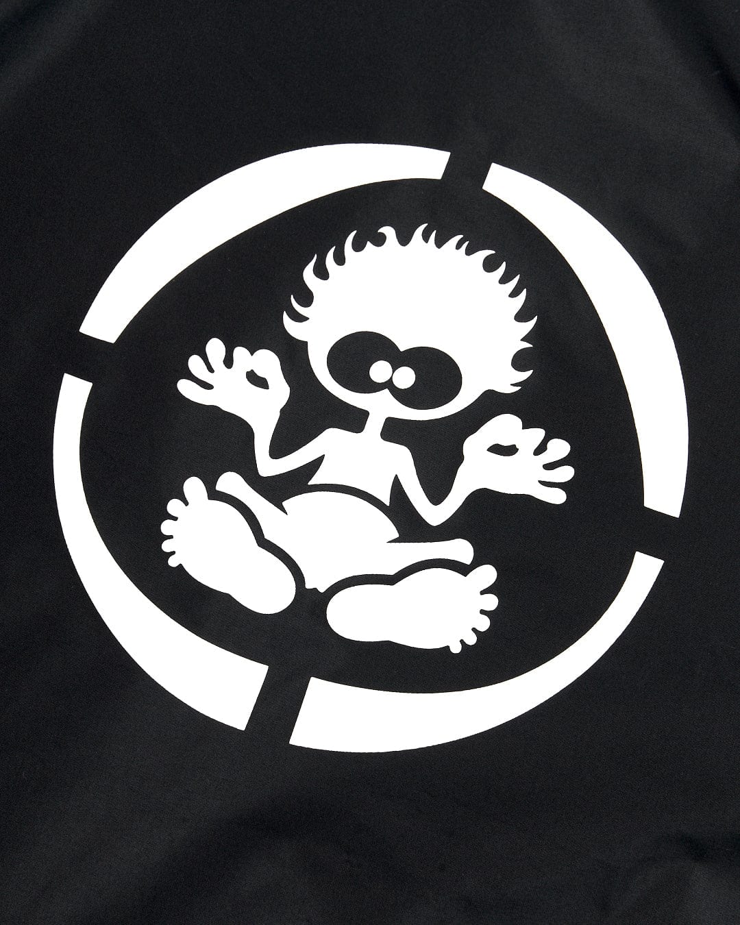 White cartoon figure with spiky hair, round glasses, and an open-mouthed expression, seated cross-legged inside a circle on a black background, looking cozy in a Saltrock Recycled Kids Changing Robe - Black/Red.