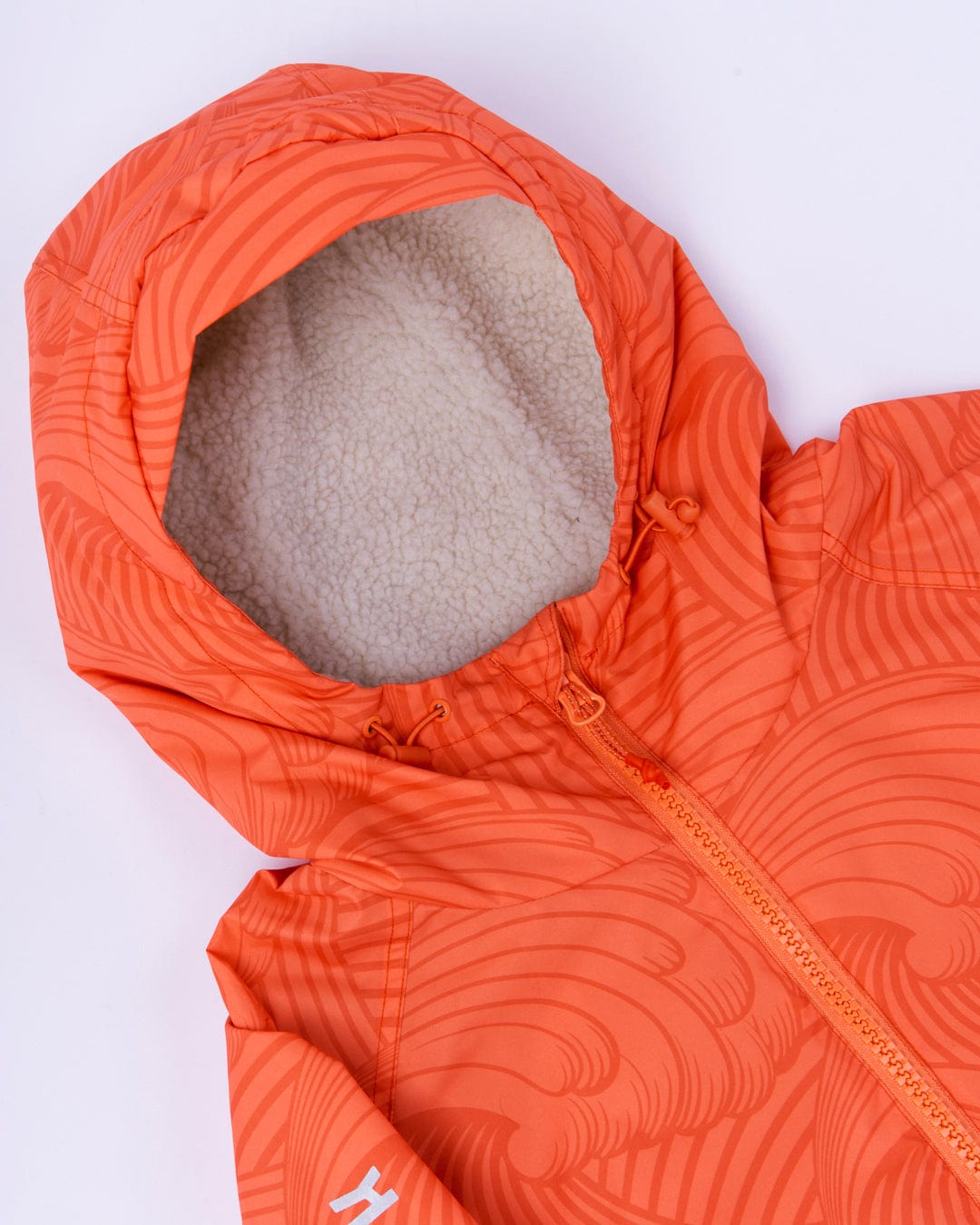 Light Orange hooded jacket made from 3K waterproof ripstop, with patterned design and fleece lining, displayed on a white background.