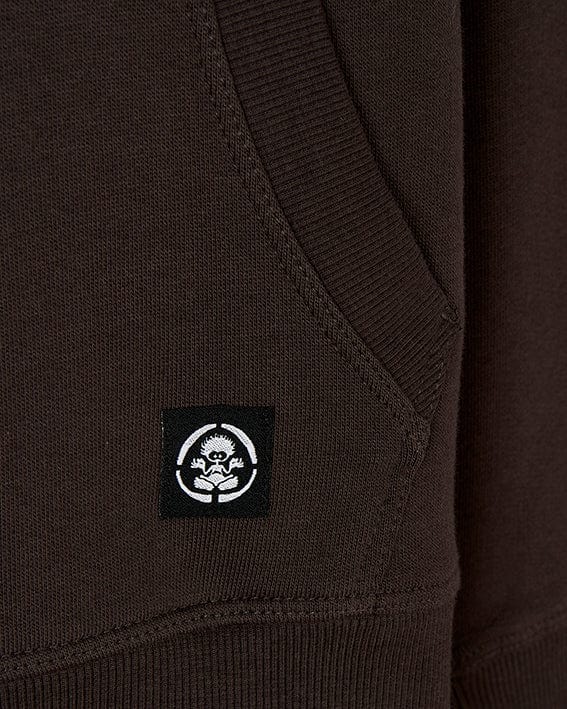 A Saltrock branded Free Spirit - Kids Pop Hoodie - Brown with a large printed graphic of a skull and crossbones, featuring an open pocket.