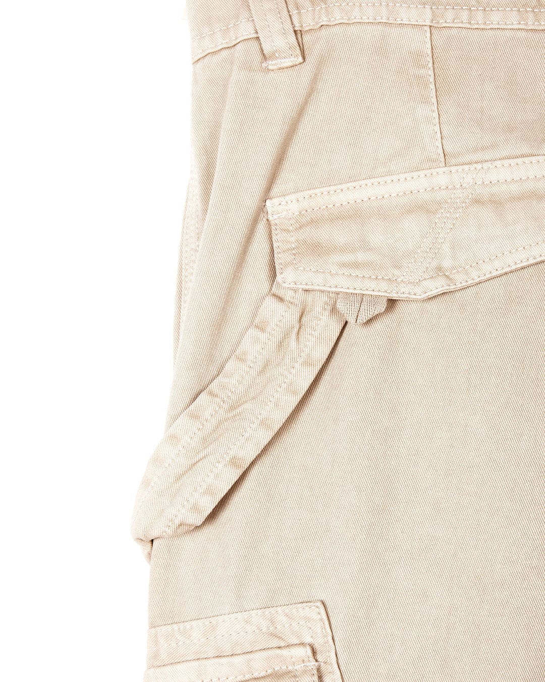 A close-up image of a cream Saltrock Godrevy Mens Cargo Trouser.