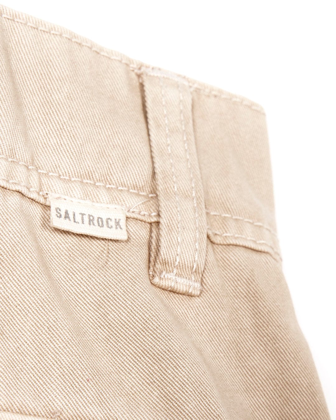A pair of Godrevy - Mens Cargo Trousers - Cream with the word Saltrock on them, perfect for outdoor adventures.