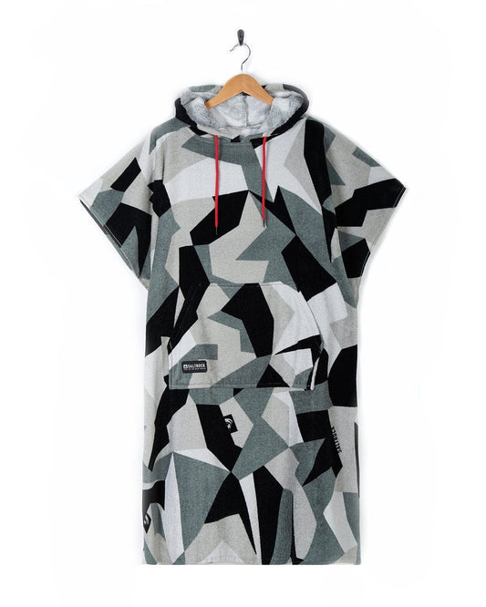 Hooded t-shirt with geometric pattern, crafted from 100% cotton, hung on a wooden hanger against a white background. 
Product Name: Geo Camo - Changing Towel - Grey
Brand Name: Saltrock