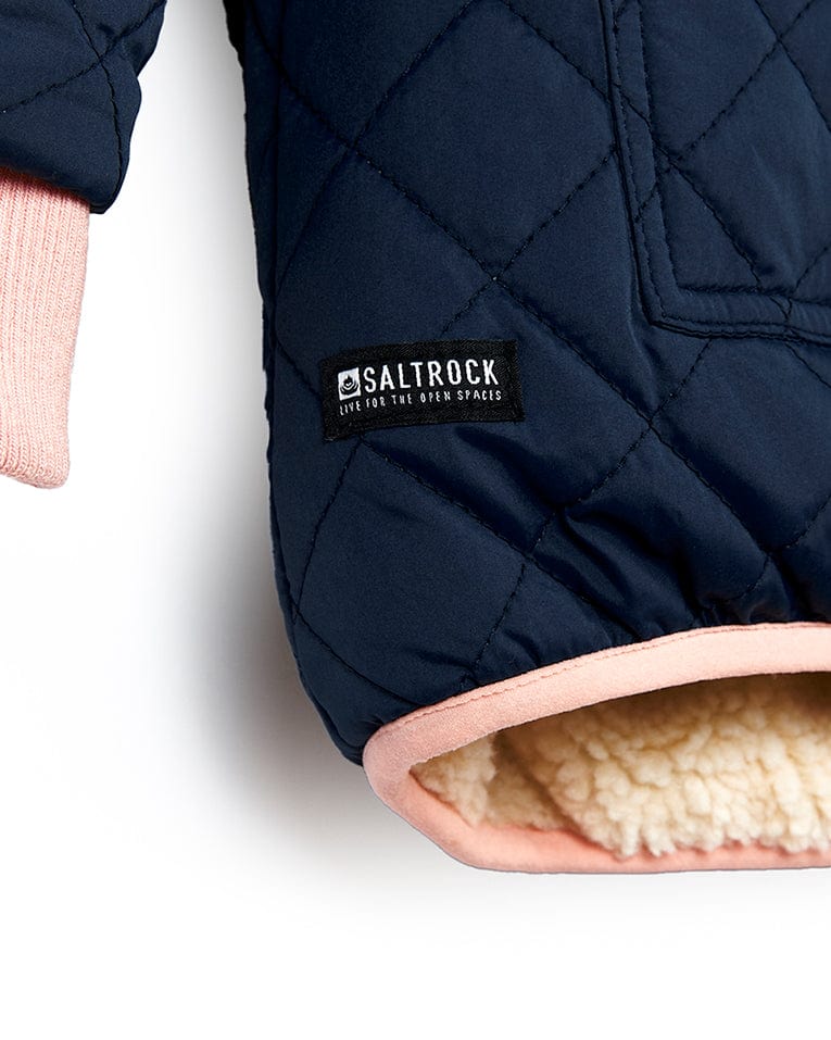 A Saltrock Hadleigh - Reversible Coat - Blue/Cream with a pink lining and quilted jacket.