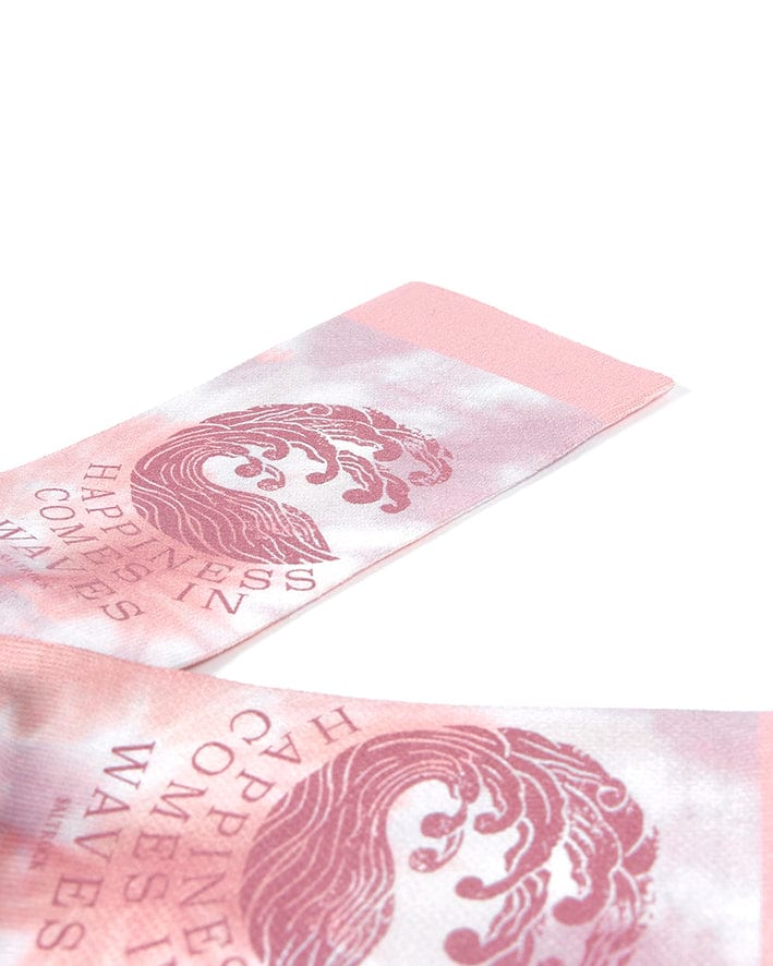 A pair of Happiness - Womens Socks - Pink by Saltrock with a pink and white tie dye design.