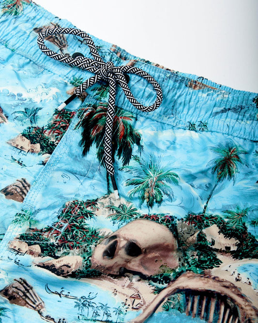 Hawaiian Isle swim shorts featuring a tropical island and pirate-themed print, including palm trees, a skull, and treasure, with an elasticated waist and black-and-white striped drawstring by Saltrock.