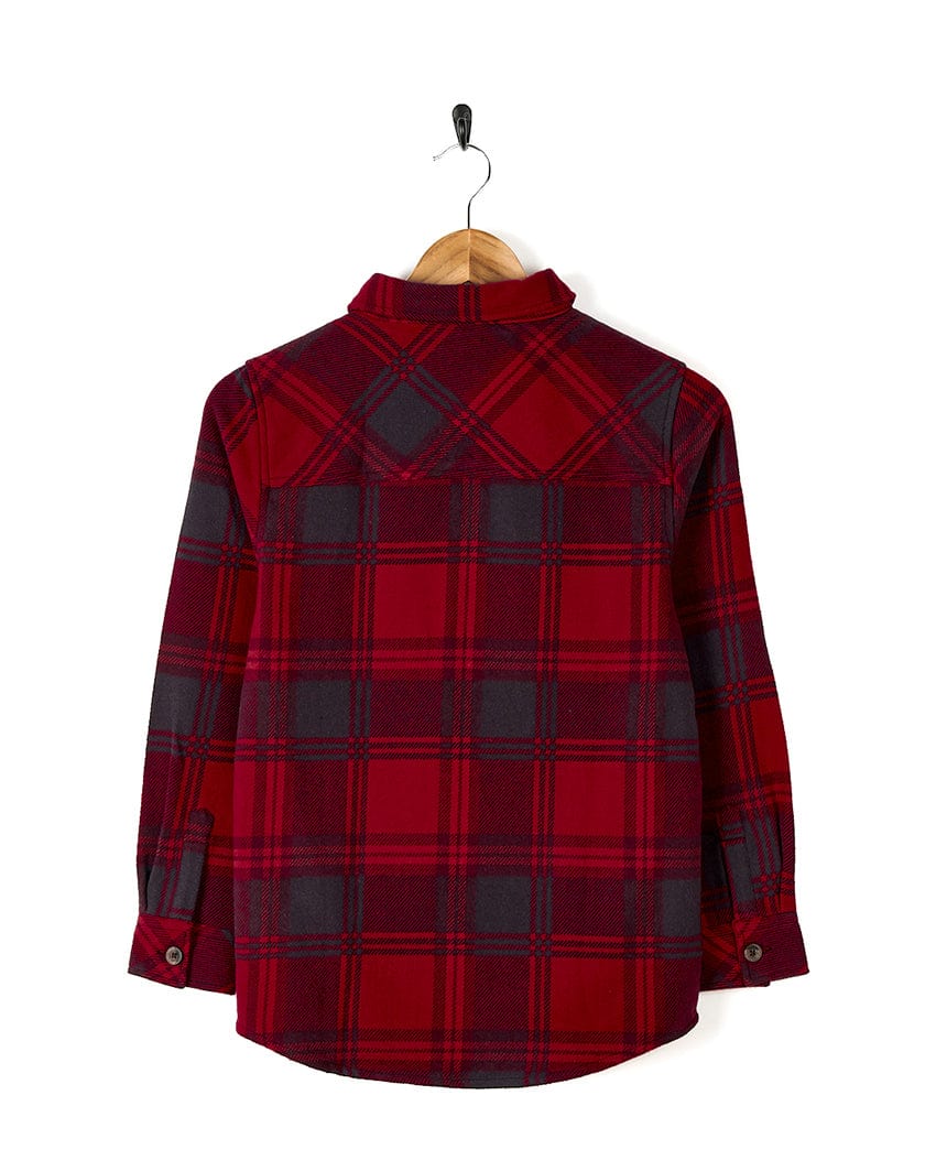 A Saltrock Hawkins - Hooded Long Sleeve Check Shirt - Red hanging on a hanger with durable cotton fabric.