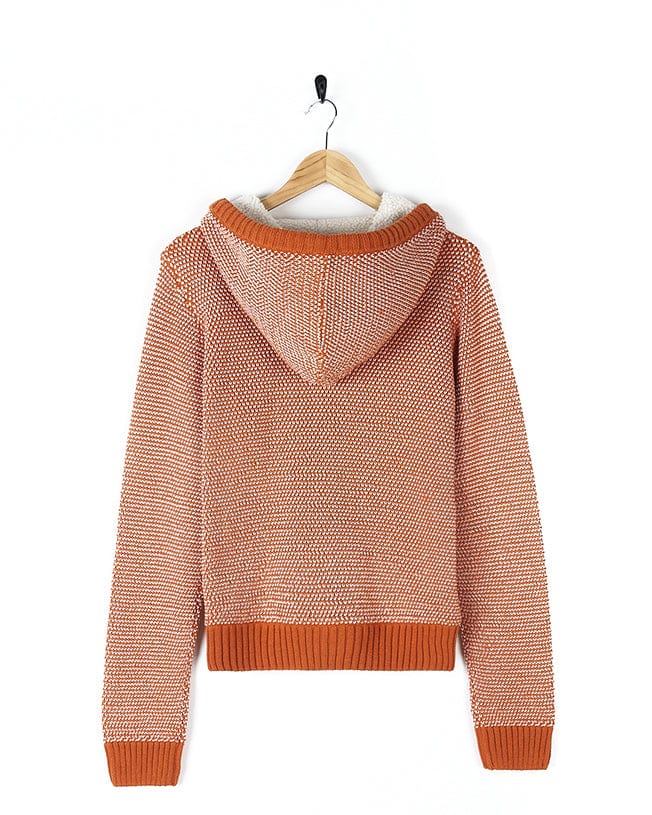 A Saltrock orange sweater with a hood on a hanger.
