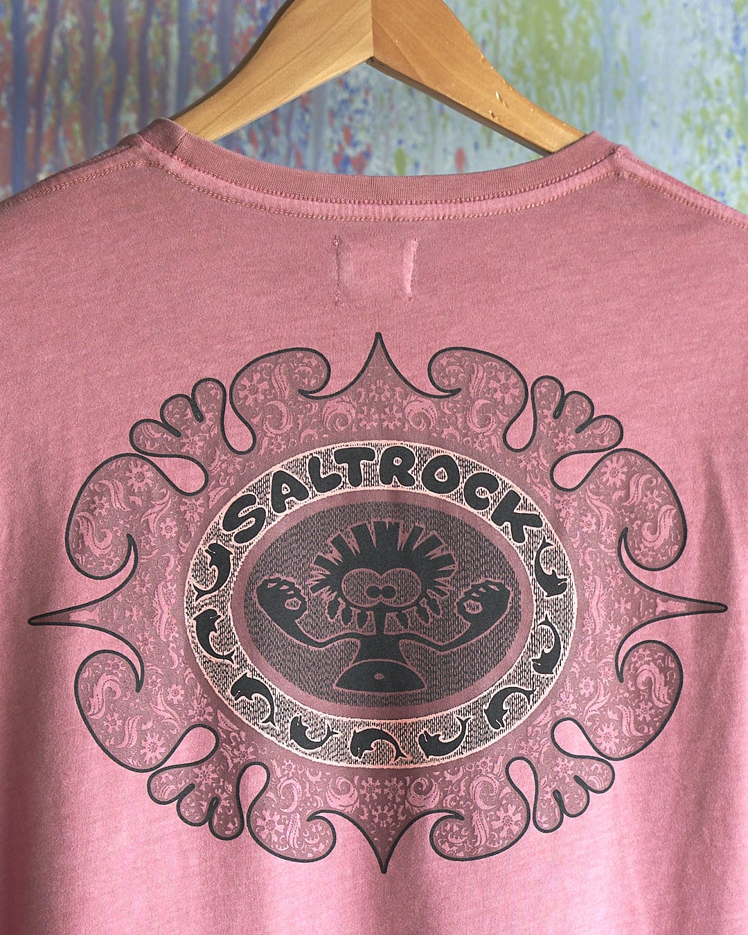 A Heraldic Tok - Limited Edition 35 Years T-Shirt with an ornate design on it.